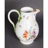 NINETEENTH CENTURY CONTINENTAL WRYTHEN MOULDED PORCELAIN JUG, of footed form, painted in colours
