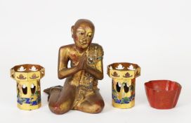 EARLY 20th CENTURY CARVED WOOD KNEELING BUDDHA, coloured in gold to a lacquer ground with hands in