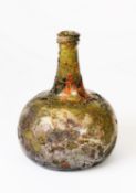 PROBABLY DUTCH EARLY 18TH CENTURY GREEN GLASS ONION BOTTLE, with deep kick-up, some iridescence