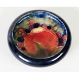WILLIAM MOORCRCOFT ‘POMEGRANATE’ PATTERN TUBE LINED POTTERY SMALL DISH, painted in tones of red,