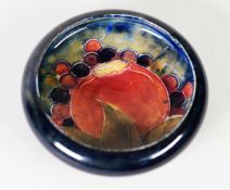 WILLIAM MOORCRCOFT ‘POMEGRANATE’ PATTERN TUBE LINED POTTERY SMALL DISH, painted in tones of red,