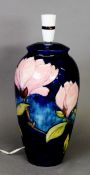 Moorcroft pottery tall ovular vase table lamp, with large red flowers on a royal blue ground, 13” (