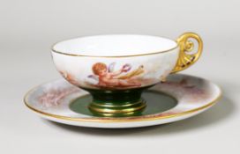 EARLY TWENTIETH CENTURY SEVRES PORCELAIN TEACUP and SAUCER, the cup finely enamelled with THREE