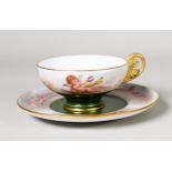 EARLY TWENTIETH CENTURY SEVRES PORCELAIN TEACUP and SAUCER, the cup finely enamelled with THREE