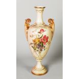 EARLY TWENTIETH CENTURY ROYAL WORCESTER BLUSH GROUND PORCELAIN TWO HANDLED PEDESTAL VASE, of slender