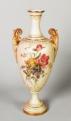 EARLY TWENTIETH CENTURY ROYAL WORCESTER BLUSH GROUND PORCELAIN TWO HANDLED PEDESTAL VASE, of slender