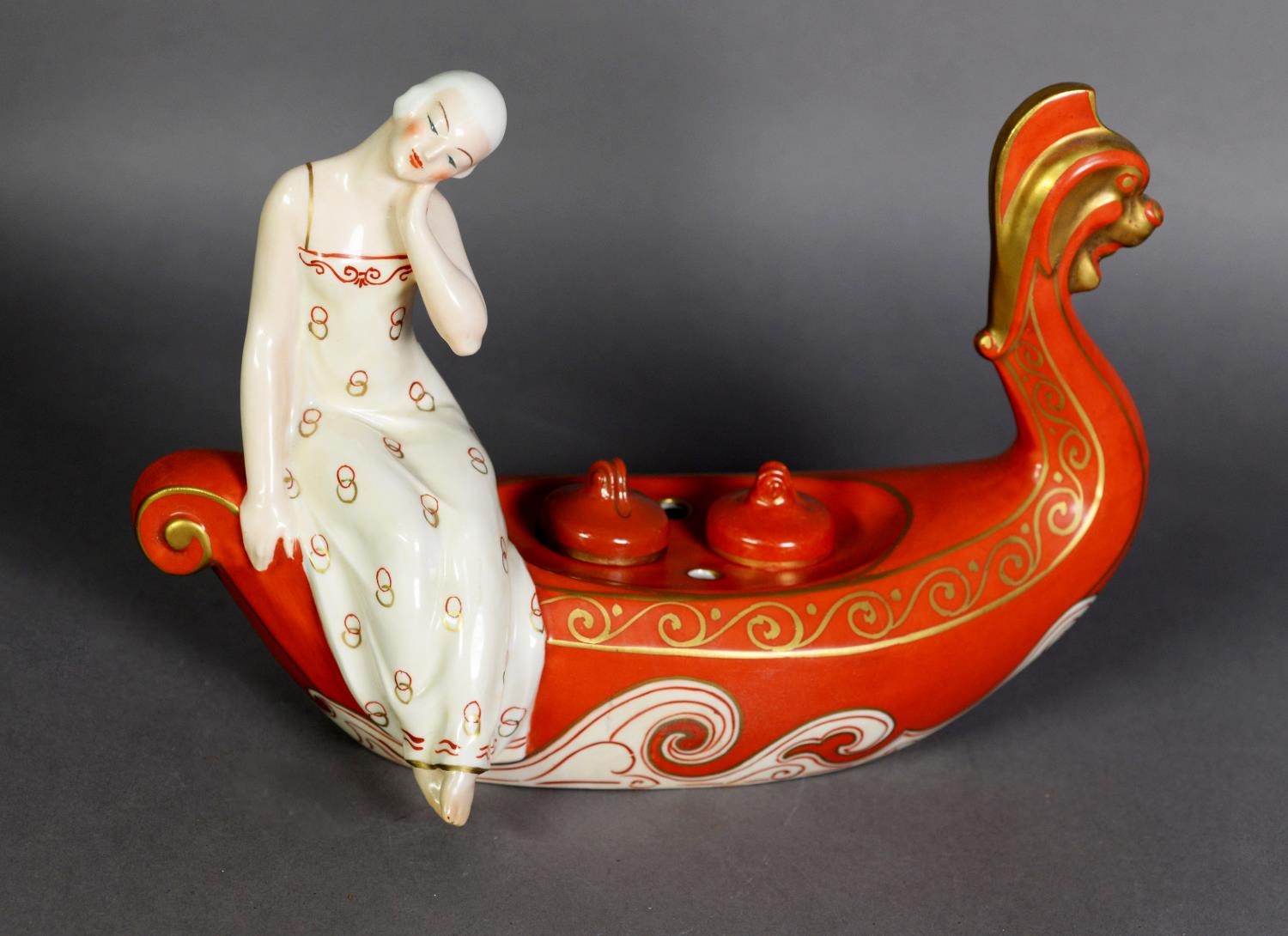 ROBJ, PARIS, ‘ALADIN LUXE’ PORCELAIN ART DECO FIGURAL INK STAND, painted in burnt orange and gilt