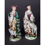 A PAIR OF PATCH PERIOD DERBY FIGURE GROUP OF A SHEPHERD AND SHEPHERDESS, c.1765, he with sheepdog