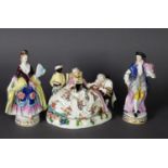 THREE 19TH CENTURY PORCELAIN FIGURE GROUPS, one as a woman with pug being wooed by a suitor, the