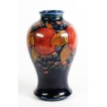 WILLIAM MOORCROFT POMEGRANATE POTTERY TUBE LINED POTTERY VASE, of baluster form, decorated in tone