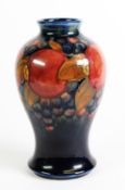 WILLIAM MOORCROFT POMEGRANATE POTTERY TUBE LINED POTTERY VASE, of baluster form, decorated in tone