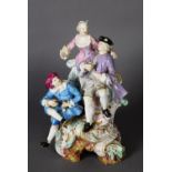 19TH CENTURY MEISSEN FIGURE GROUP, modelled as gentleman and lady in 18th century dress sharing wine