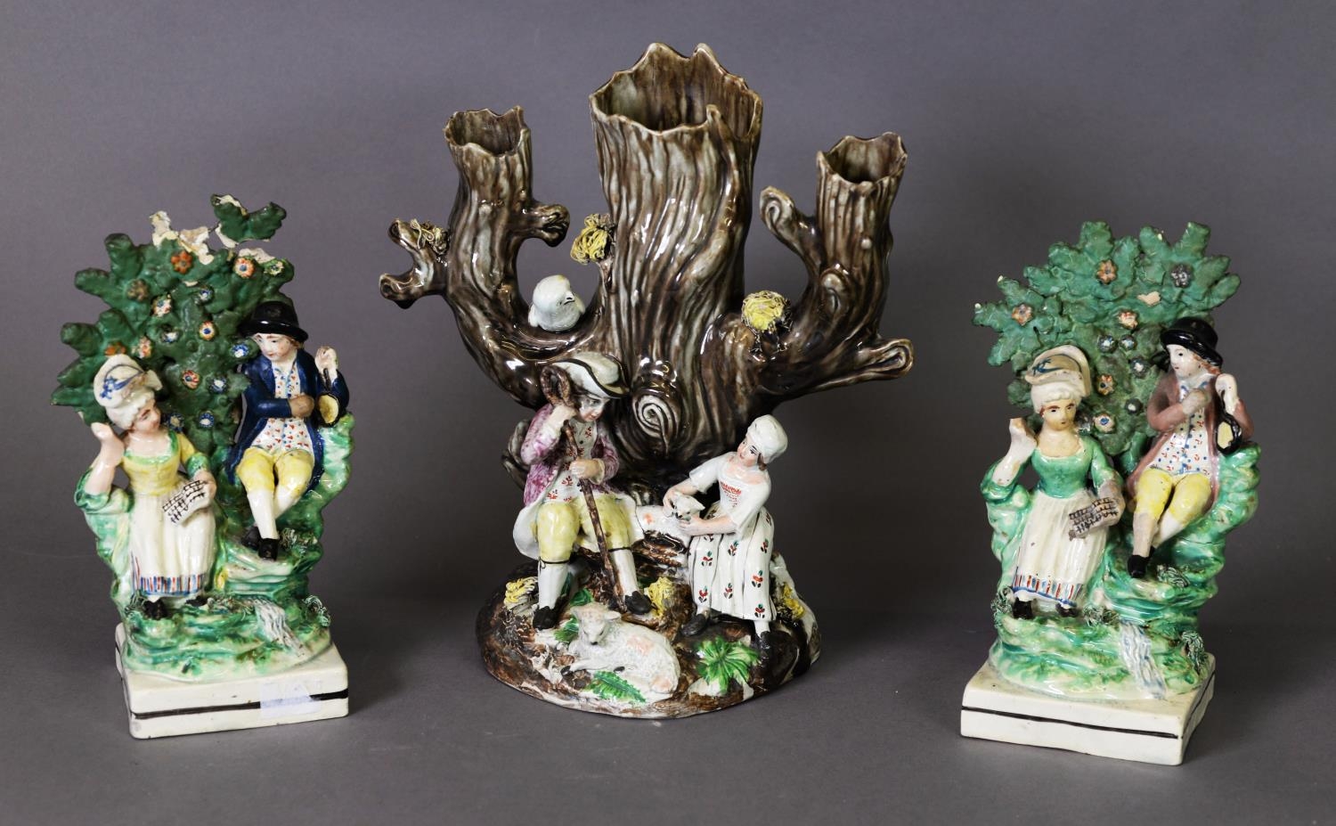 A PAIR OF STAFFORDSHIRE PEARLWARE BROCAGE GROUPS, c.1810, on square socle bases, plus a slightly
