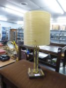 MODERNIST 1950’S/60’S TABLE LAMP, WITH TUBULAR METAL AND YELLOW PLASTIC COLUMN AND WOODEN SQUARE