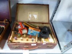 AN ATTACHÉ CASE, CONTAINING A RECORDER, VINTAGE TOYS, PLAYING CARDS, ETC. AND A BOXED PAIR OF ‘