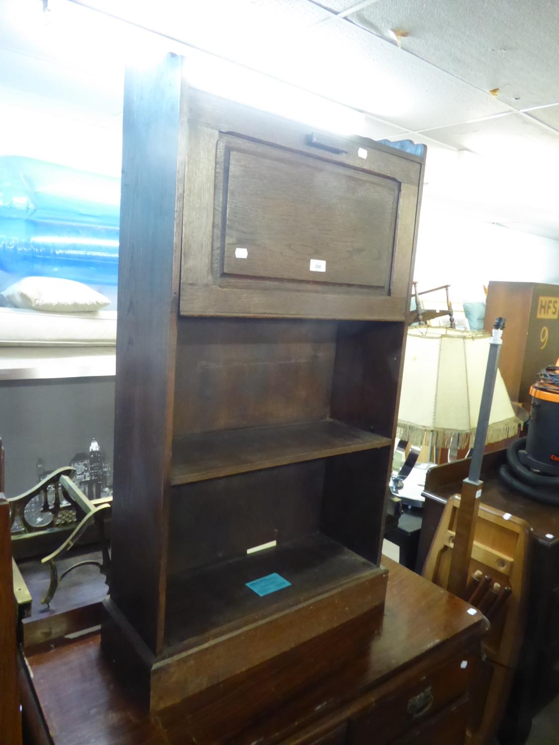 AN OAK SECRETAIRE BOOKCASE WITH UPRIGHT FALL-FRONT AND TWO OPEN SHELVES BELOW