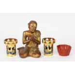 EARLY 20th CENTURY CARVED WOOD KNEELING BUDDHA, coloured in gold to a lacquer ground with hands in