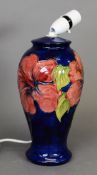 Moorcroft pottery tall ovular vase table lamp, with large red flowers on a royal blue ground, 11” (