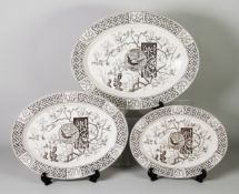 MINTON'S AESTHETIC MOVEMENT graduated trio of oval plates, with brown printed Faisant pattern