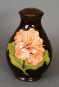 Moorcroft pottery vase table lamp, with large pink flowers on a black background, 8 ¼” (21 cm) H