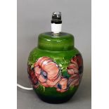 Modern Moorcroft Pottery ovular table lamp, with tube lined red flowers on green ground, 8 ½” (21.