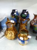 TWO COPPER LUSTRE JUGS, ONE EMBOSSED WITH BALLET DANCERS, ONE WITH DEER, 8” HIGH; ANOTHER SMALLER