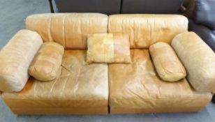 A LIGHT TAN HIDE BED SETTEE, SPLITS INTO 2 SECTIONS