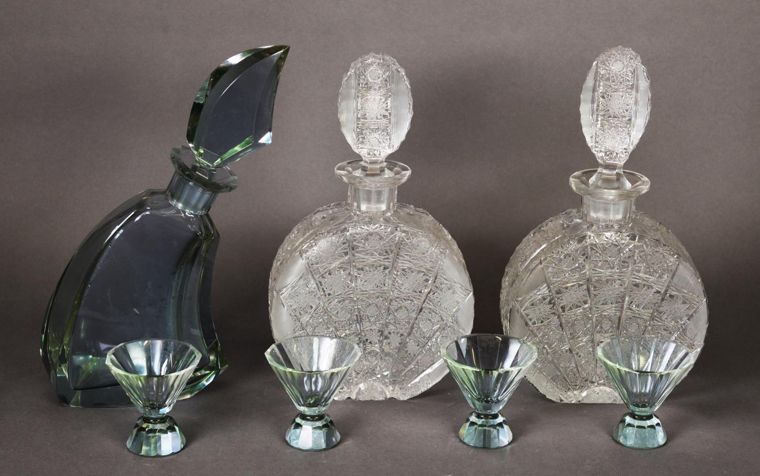 NEAR PAIR OF HAND-BLOWN MOON FLASK DECANTERS, slight variation in the stoppers, plus a 1950s vodka
