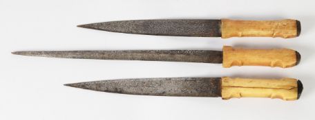 SUITE OF THREE NORTH AFRICAN/SUDANESE VINTAGE NATIVE BONE HANDLE DAGGERS, IN CROCODILE SKIN