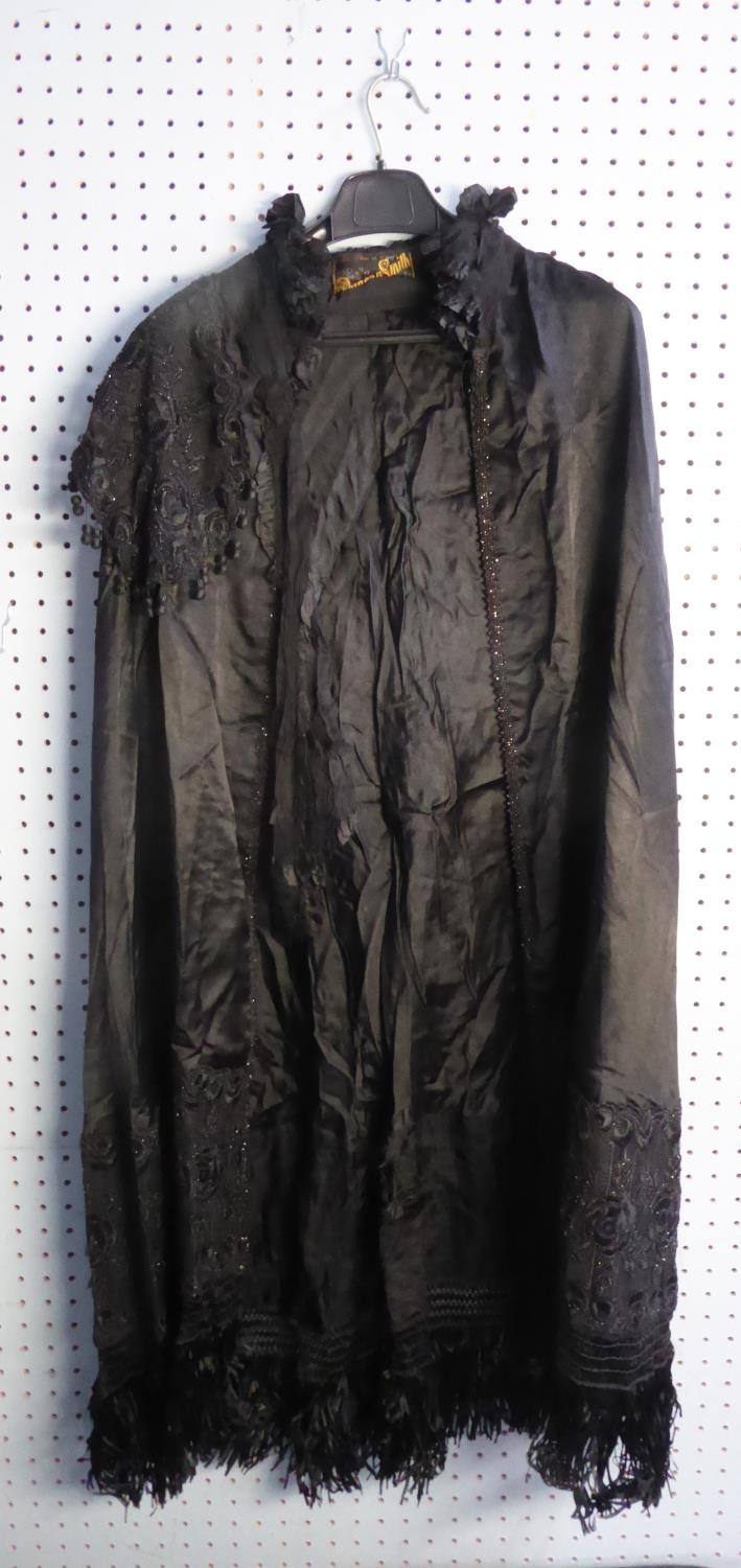 LADY'S LATE VICTORIAN LONG BLACK SILK CAPE, with frill black lace collar, attached black net and