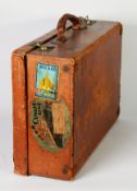 CIRCA 1930s SMALL BROWN LEATHER SUITCASE applied with Cunard Line oval label for travel to Europe