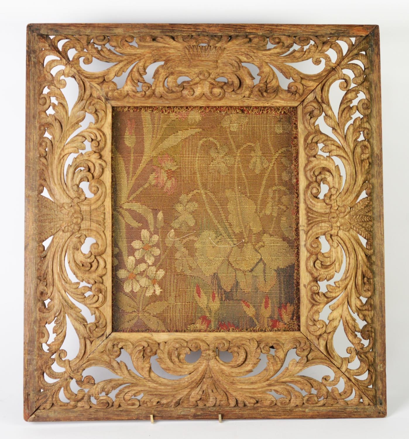 NINETEENTH CENTURY EUROPEAN CARVED AND PIERCED OAK OBLONG PICTURE FRAME, foliate scroll design to