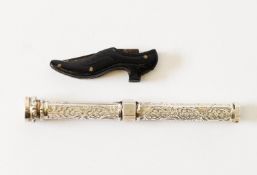 SMALL EARLY 20th CENTURY CARVED EBONY CLASP KNIFE IN THE FORM OF A PAIR OF LADIES SHOES, having