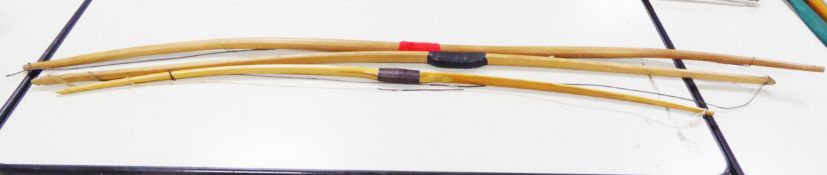 TRADITIONALLY CARVED ONE-PIECE BLOND HARDWOOD LONGBOW, of rounded form, approximately 78in (198.1cm)