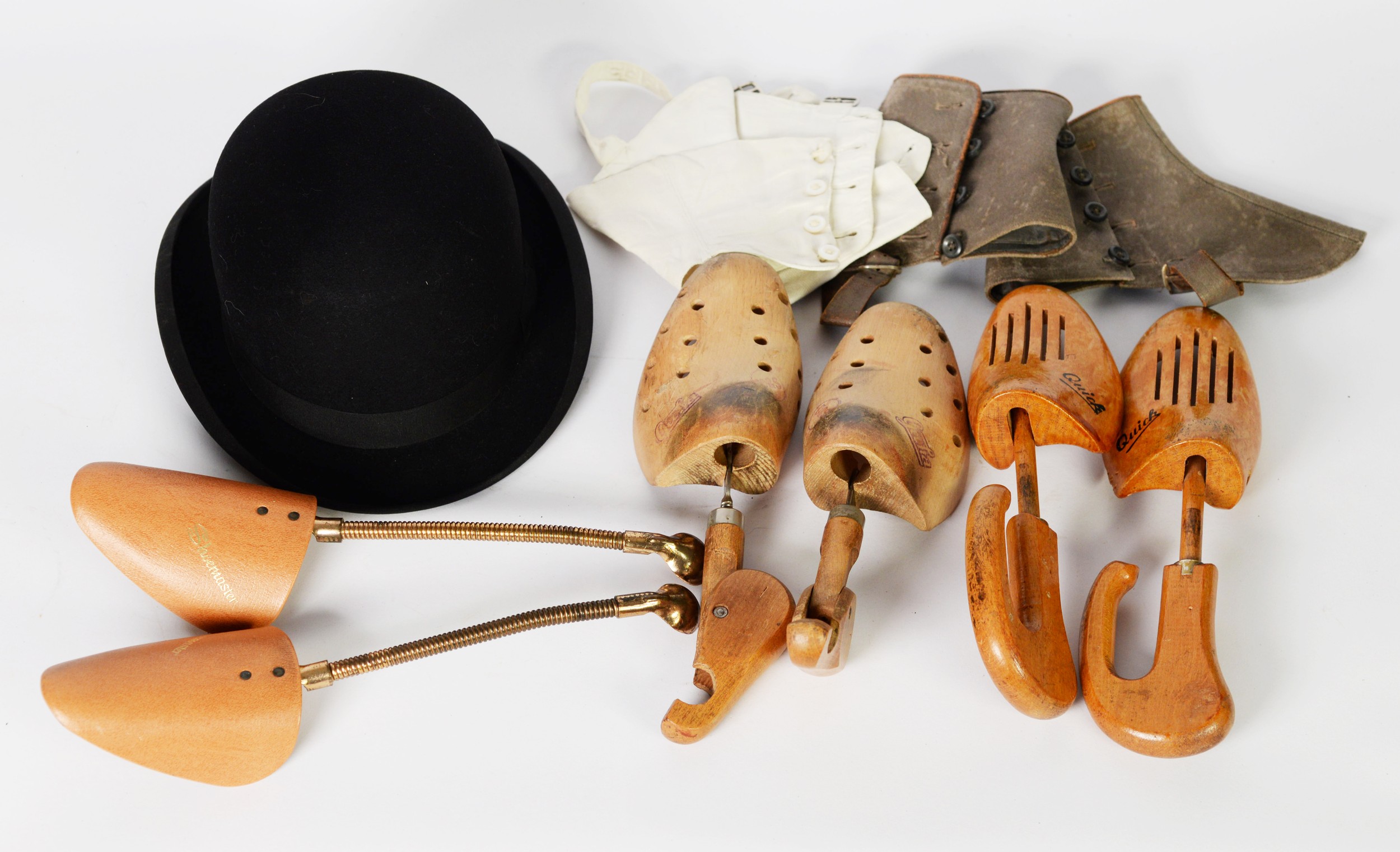 DUNN & CO. BLACK BOWLER HAT; three pairs of wood and other SHOETREES; a pair of suede leather