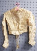 VICTORIAN ELABORATE WHITE LACE AND CREAM SILK BLOUSE, hook fastening up the back and boned, ruched