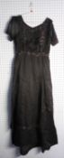 LADY'S EDWARDIAN BLACK FABRIC FULL-LENGTH DRESS with round neck, short sleeves, hook fastening up