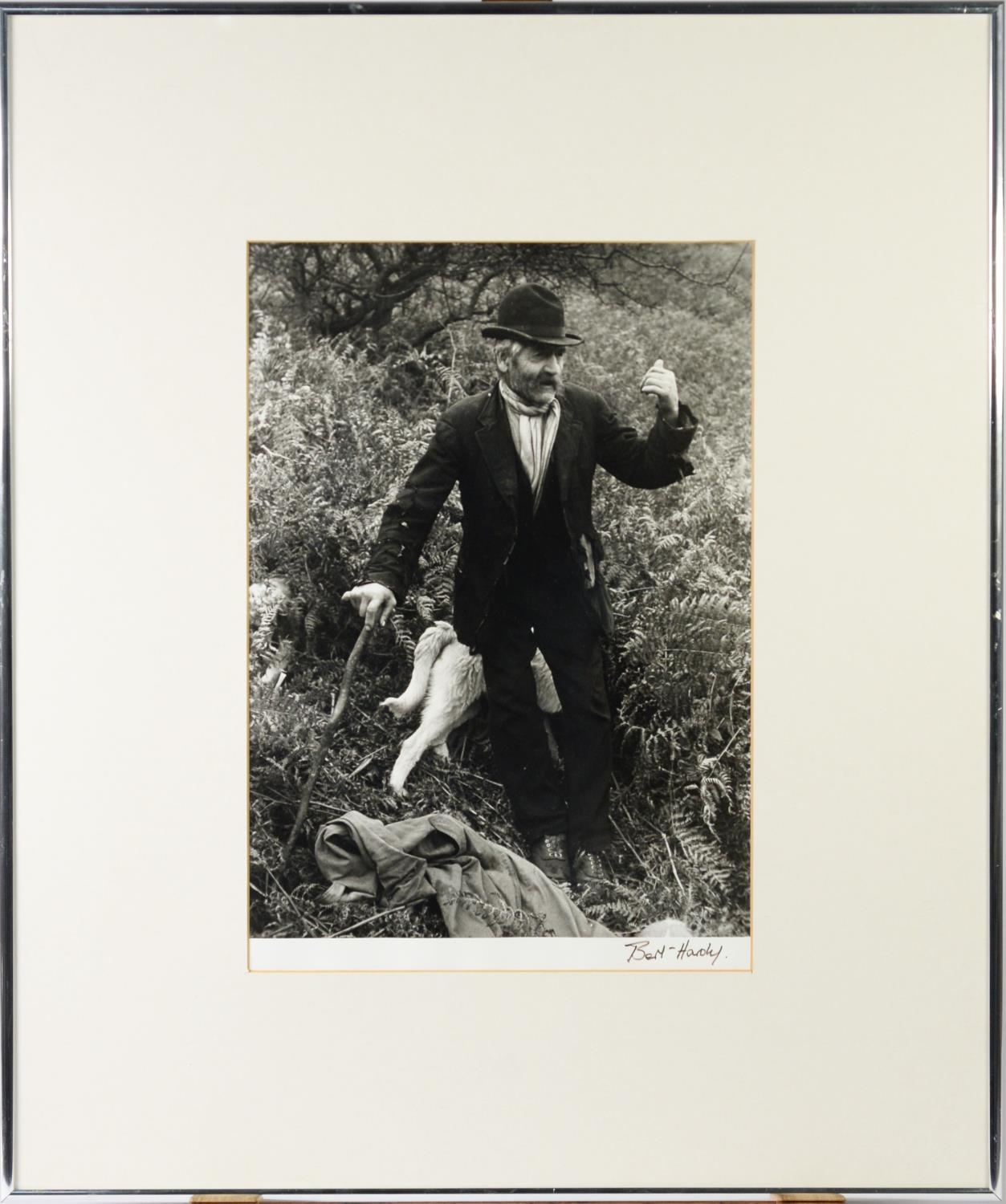 TWO VINTAGE BLACK AND WHITE PHOTOGRAPHIC PRINTS, ONE of a man with dogs amongst ferns, signed BEN - Image 2 of 3
