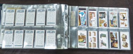 RING BINDER ENCLOSING A COLLECTION OF TOBACCO CARDS BY VARIOUS COMPANIES, mainly full sets to