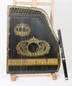 GERMAN EARLY 20th CENTURY EBONISED WOOD PIANO HARP with colour printed decoration featuring