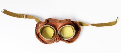 PAIR OF WWII PILOT'S GOGGLES, soft tan leather with plush fabric rims, oval yellow tinted lenses