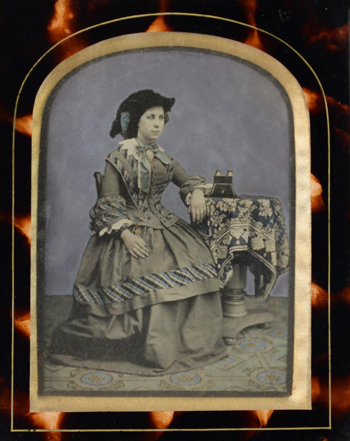 TWO VICTORIAN SLIGHLY TINTED PORTRAIT DAGUERREOTYPES in original glazed frames, ONE with revealed