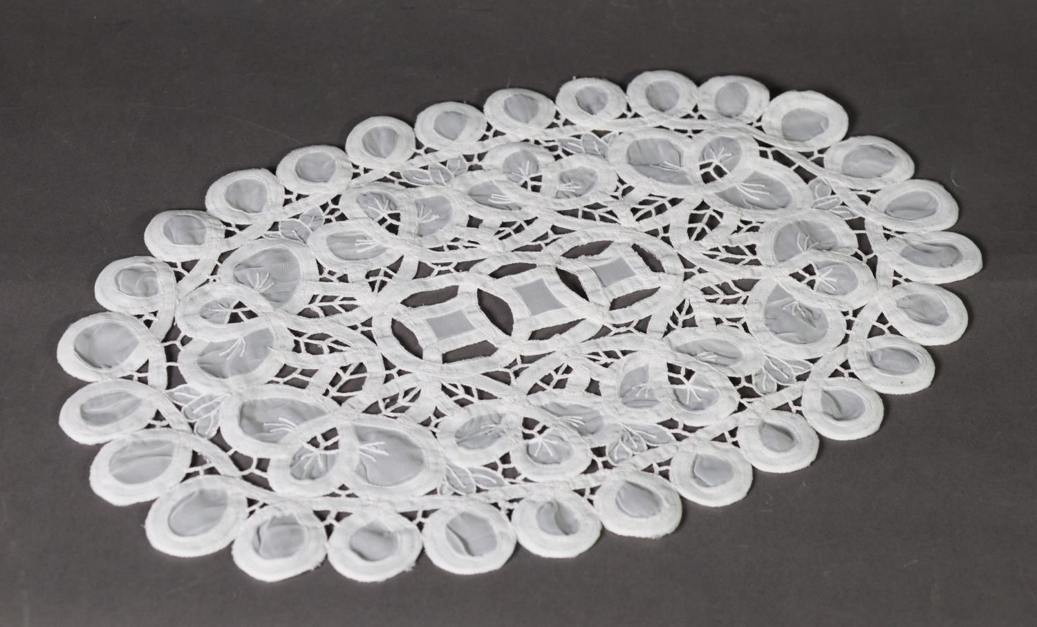 FINE SET OF 12 WHITE OPEN WORK CROCHET AND GAUZE OVAL PLACE MATS, with looped borders, 16 1/2in (