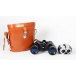 PAIR OF TASCO 10 x 50mm MAGNIFICATION BINOCULARS, in plush lined light brown leather case and a pair