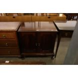 CHIPPENDALE STYLE FIGURED MAHOGANY SMALL CUPBOARD, WITH GADROON CARVED EDGES, TWO FRAMED PANEL