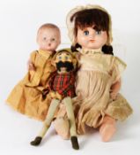 TWO CIRCA 1940's COMPOSITION DRESSED DOLLS, AND ANOTHER SOFT PLASTIC FACED TARTAN DRESSED TOY (3)