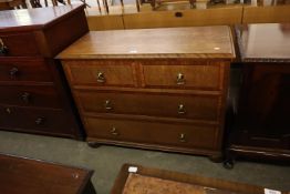 AN OAK CHEST OF TWO SHORT AND TWO LONG DRAWERS, ON BUN FEET, 3’6” WIDE