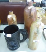 THREE 19TH CENTURY SALT GLAZED STONE WARE CYLINDRICAL FLAGONS, TWO FAWN AND ONE BROWN AND A BLACK