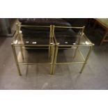 A PAIR OF GILT TUBULAR BRASS AND PLATE GLASS TWO-TIER BEDSIDE TABLES