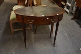 A MAHOGANY OVAL WRITING TABLE WITH INLET LEATHER TOP, FRIEZE DRAWER, ON FOUR SQUARE TAPERING LEGS